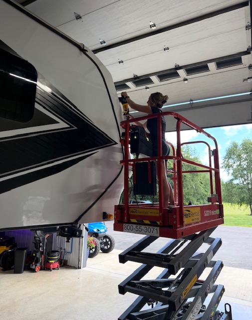 Detailing on a scissor lift