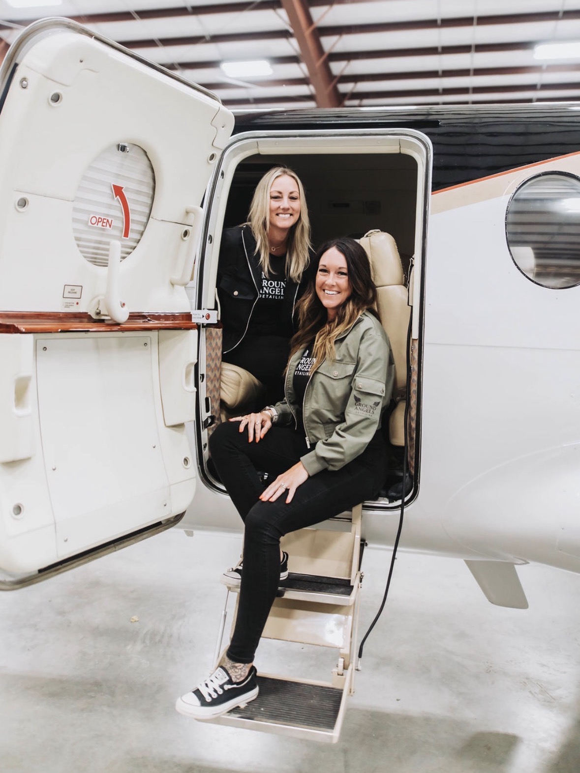 Kristina and Alissa inside a private jet
